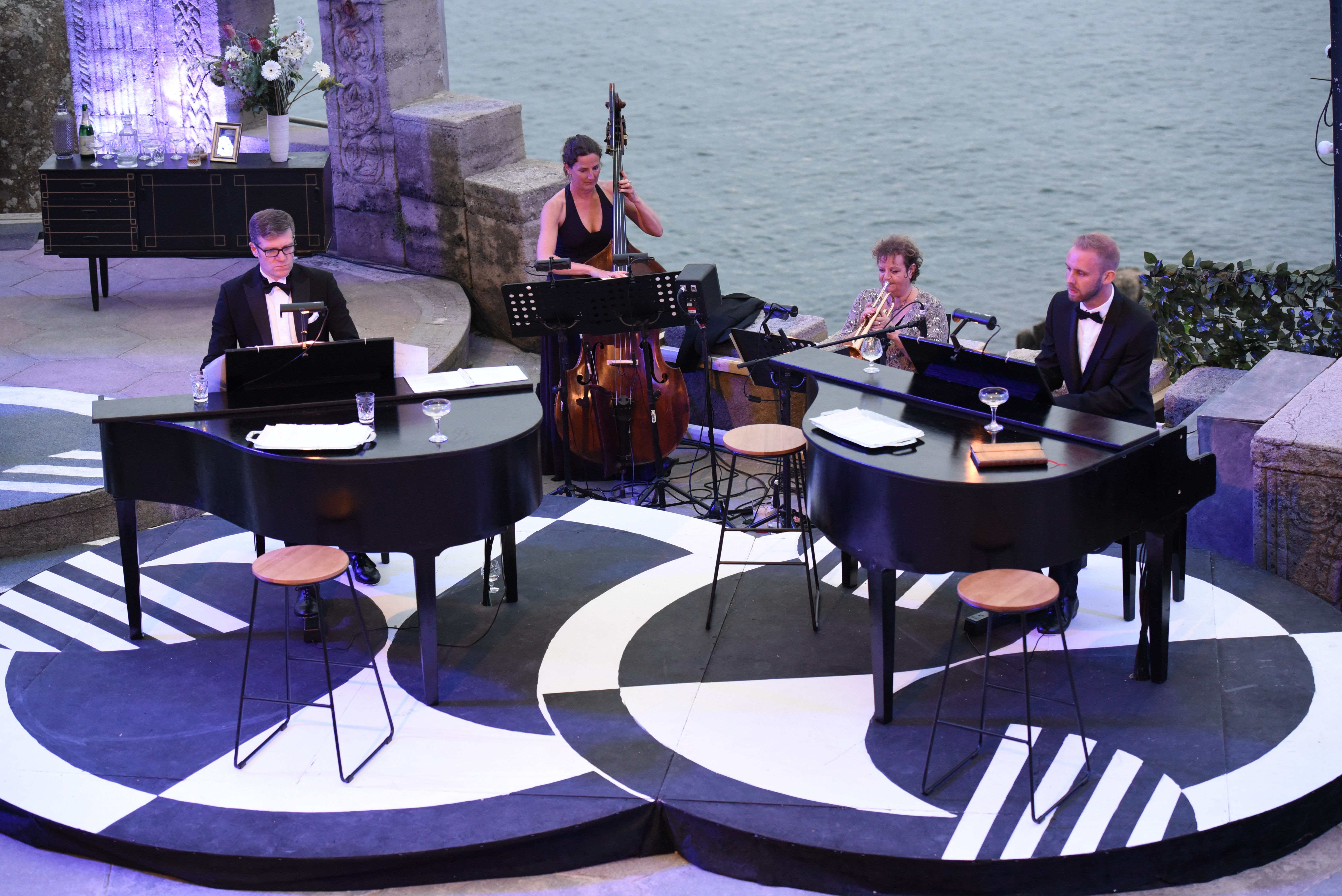 Annette Brown playing the trumpet in Sedos' 2019 production of A Swell Party at the Minack Theatre in Cornwall