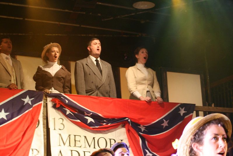 Paul Cozens, flanked by Deborah Lean and Charlotte Price, in 2009’s production of Parade